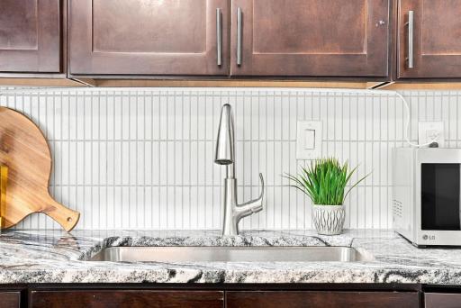 Clean, polished kitchen finishes create a timeless and approachable feel.