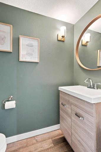 A stylish main-level powder bath adds convenience for guests.