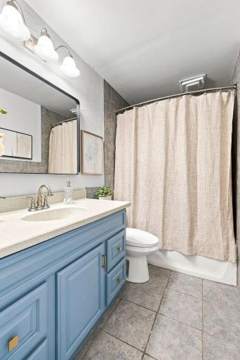 The updated full bath offers fresh finishes and a clean, modern feel.