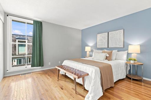 Natural light and generous proportions create a comfortable primary bedroom setting.