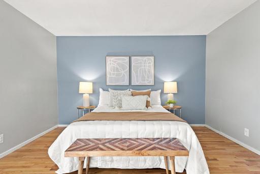 Spacious upper-level bedroom with excellent storage and convenient in-unit laundry.