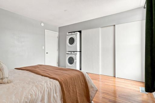 Full-size laundry conveniently located upstairs alongside generous closet storage.