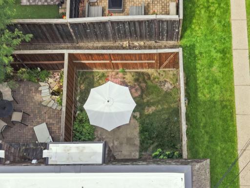 A bird’s-eye view of the private patio and turf area just outside the dining room.
