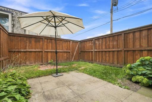 A private fenced patio creates an easy outdoor extension of the living space.