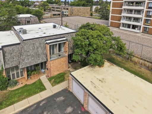 The townhome offers a private setting with outdoor space and convenient garage access.
