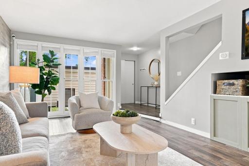 A warm, inviting living room complemented by custom finishes and abundant natural light.