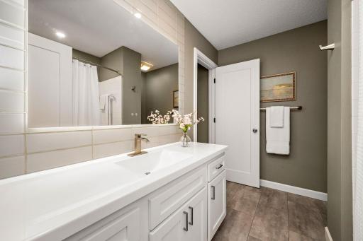 Clean, modern finishes and thoughtful updates create a beautiful and inviting bathroom.