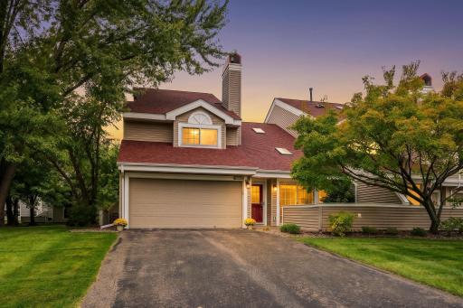 Welcome Home! Beautifully updated, end-unit townhome tucked into a peaceful, tree-lined Plymouth neighborhood with mature trees and inviting curb appeal.