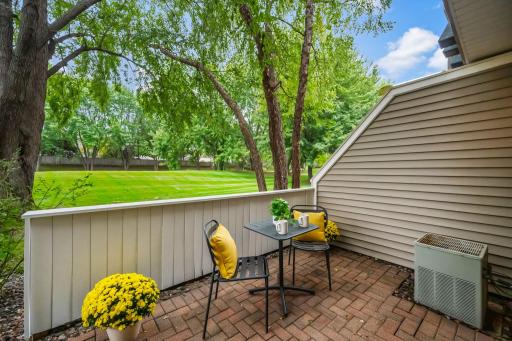 Step outside the kitchen to enjoy a second private patio, mature trees and generous green space - a wonderful extension of the kitchen.