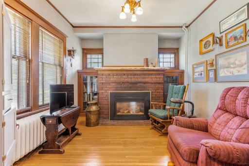Behind the pocket doors, a hearth room.