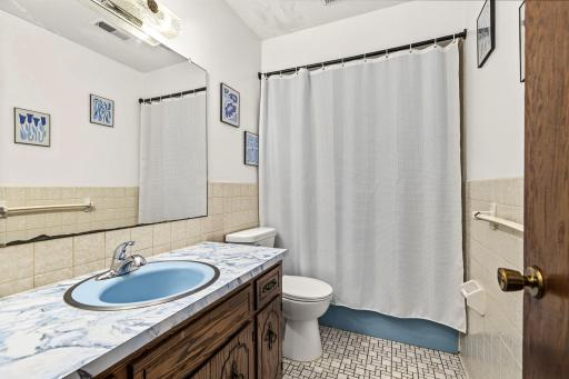 Garden level full bathroom in peaceful blue