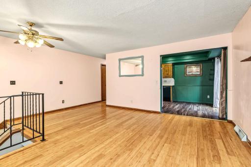 Living room opens to hallway and kitchen.
