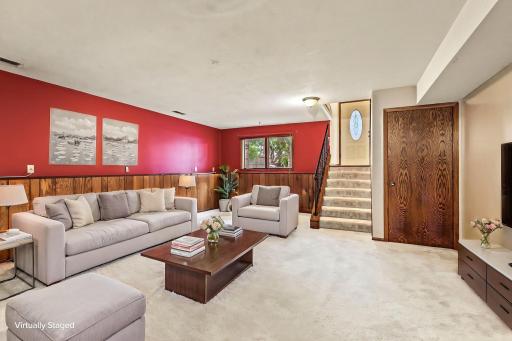 Fun and spacious lower level family room, virtually staged