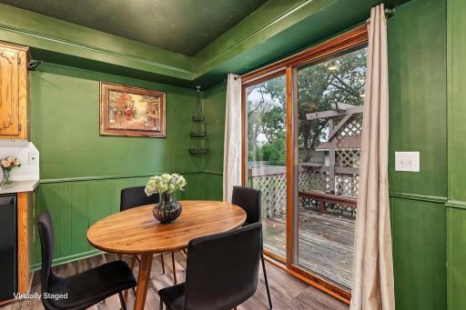Easy eat-in kitchen with sliding doors to deck, virtually staged