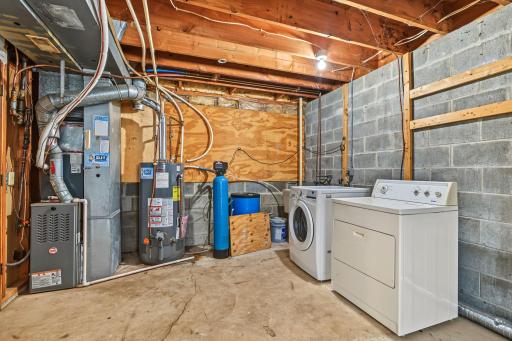 Laundry room in the unfinished bonus room. New washer.