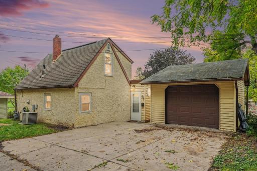 Single car garage in the back walk in area from the house - but close - and extra space to park!