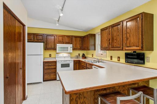 Clean, traditional wood cabinetry provide timeless look