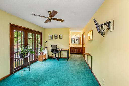 French doors lead to Juliet balcony facing the front are a beautiful touch