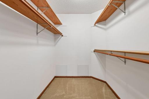 Generous walk-in closet completes the main-level primary suite.