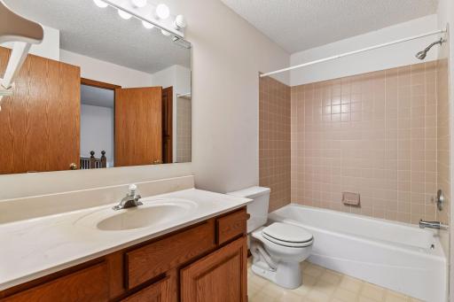Upper-level full bath conveniently connected to the bedroom.