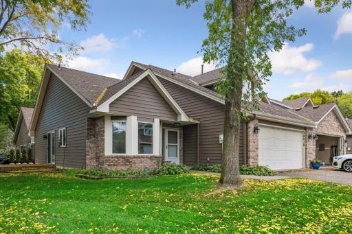 Welcome to 18512 Lime Tree Court, a spacious two-story end-unit townhome in the Minnetonka School District.