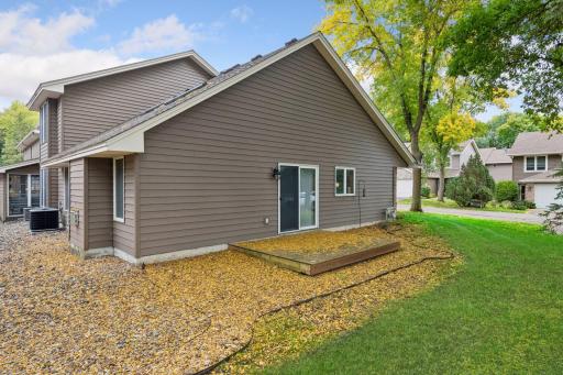 Enjoy outdoor space just off the main level, with a patio and mature surroundings.
