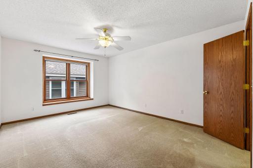 Main-level second bedroom includes a closet and plenty of natural light.