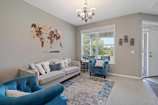 Living room at the front of the home is the perfect place to welcome guests for a visit. This space would also be perfect for a home office.