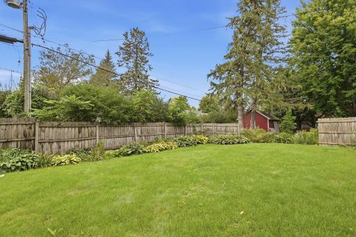 Wood fence adds to the privacy of the large backyard.
