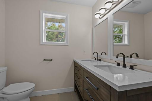 New upper vanity with double sinks and mirrors.
