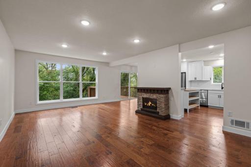 Stunning main level, open, but still some separation. Notice the massive window plus patio doors allowing natural light and beautiful views.