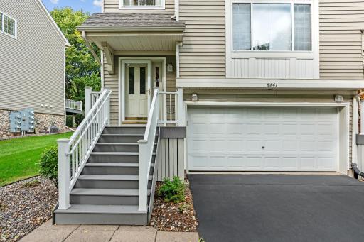 With a spacious two car garage and freshly sealed driveway...