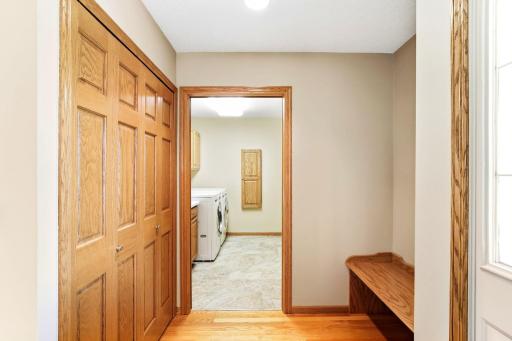 Large coat closet and convenient built in bench in mud room for your guests to remove their shoes.