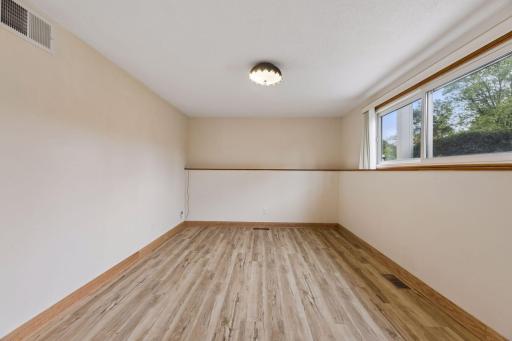 Lower-level family room with large window and natural light