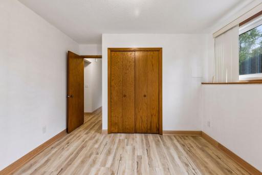 Spacious lower-level third bedroom with beautiful new flooring