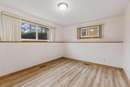 Spacious lower-level third bedroom with lots of natural light