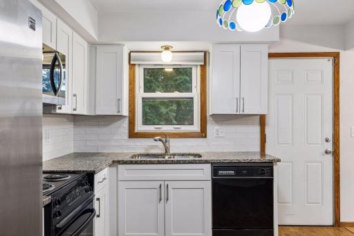 Window above sink to the spacious backyard