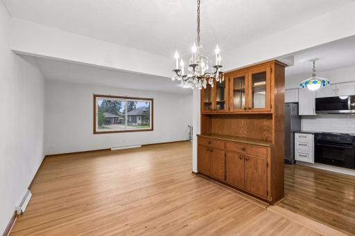 Living and dining areas flow conveniently into the refreshed kitchen
