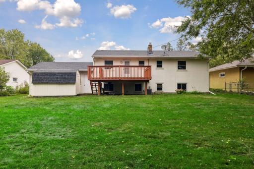 Spacious backyard with deck and storage shed