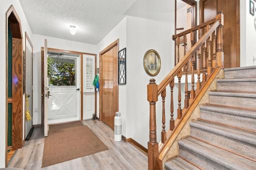 Spacious foyer offers closet and access to three car graage.