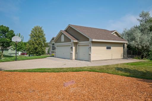 3 stall insulated garage with space on the side for another car, boat, trailer, or RV.