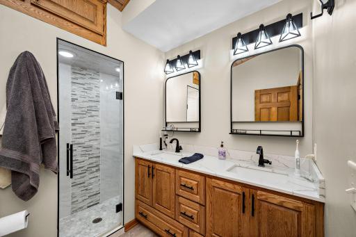 Private owners suite with walk-in shower and dual sinks