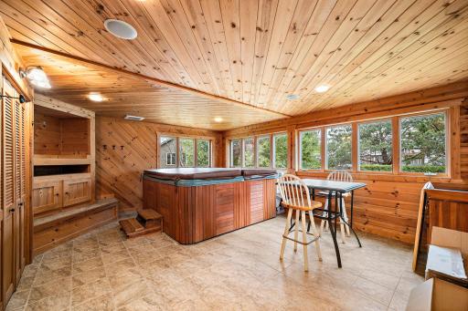 Hot tub room with natural wood work and built in entertainment