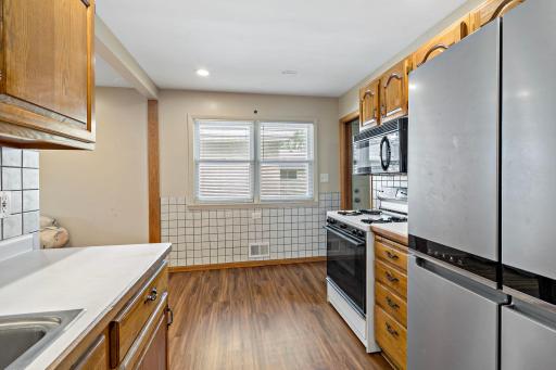 Eat-in kitchen with large window providing natural light.