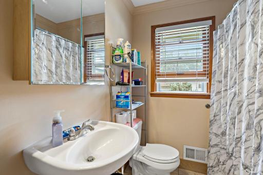 Full bathroom with pedestal sink.