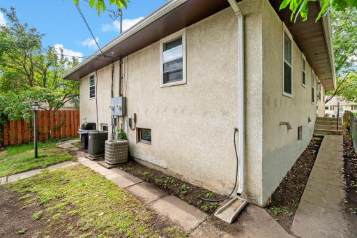 Each unit has its own walkway from the alley. Walkway to Unit 5749 side entrance.