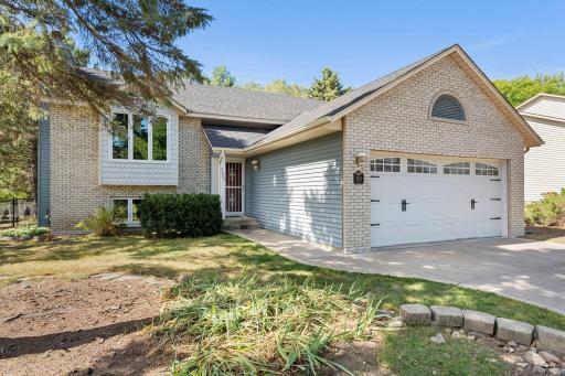 Concrete driveway w/Brick Front Elevation