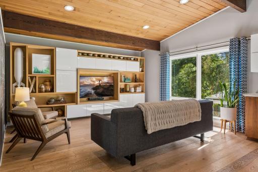 Living Room with Hardwood Floors, Tongue and Groove Vaulted Ceilings and Large Windows