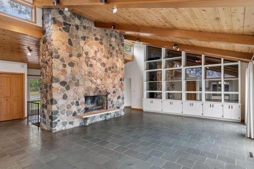 Beautiful stone surround fireplace in main floor living room