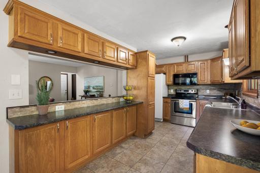 Kitchen with opening over looking living room